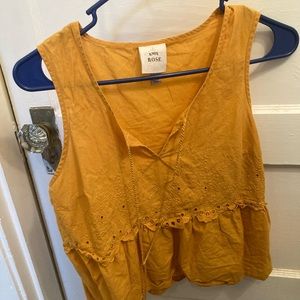 Cute boho embroidered top with fridge tassels!